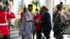 Senegal's President Macky Sall, right, is received by Nigerian Minister of Foreign Affairs Yusuf Tuggar in Abuja, Nigeria, Feb. 24, 2024. Leaders of the Economic Community of West African States met to address a political crisis in the coup-hit region.