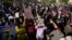 Supporters of Shiite Muslim leader Muqtada al-Sadr step on an LGBTQ+ rainbow flag in front of the Swedish Embassy in Baghdad in response to the burning of a Quran in Sweden, June. 30, 2023.