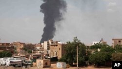 FILE - Smoke rises over Khartoum, Sudan, June 8, 2023, as fighting between the Sudanese army and paramilitary Rapid Support Forces continues. 