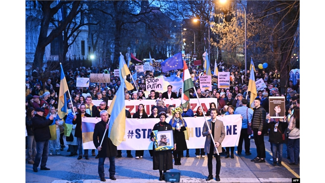 Demonstrators take part in a march in downtown Budapest, Hungary, to mark the second year of Russia's military invasion on Ukraine, Feb. 24, 2024.