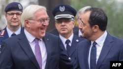 German President Frank-Walter Steinmeier (L) sharing a light moment with his Cypriot counterpart Nikos Christodouludes during his official visit to Nicosia on Feb. 12, 2024. (Stavros Ioannides / Cyprus government's Press and Information Office / AFP) 