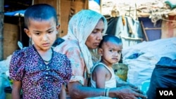 Members of a Rohingya refugee family at a ramshackle shanty colony in the north Indian state of Haryana. (Zafor Alom/VOA)