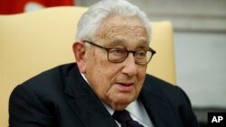 FILE - Former U.S. Secretary of State Henry Kissinger speaks during a meeting with then-President Donald Trump in the Oval Office of the White House, Oct. 10, 2017, in Washington. Kissinger died Nov. 29, 2023, at his Connecticut home. He was 100.