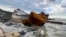 The Cameroon-flagged Pallada rests among rocks at the sea shore in Eregli, Turkey, Nov. 20, 2023. The ship broke into two due to heavy weather conditions after running aground.