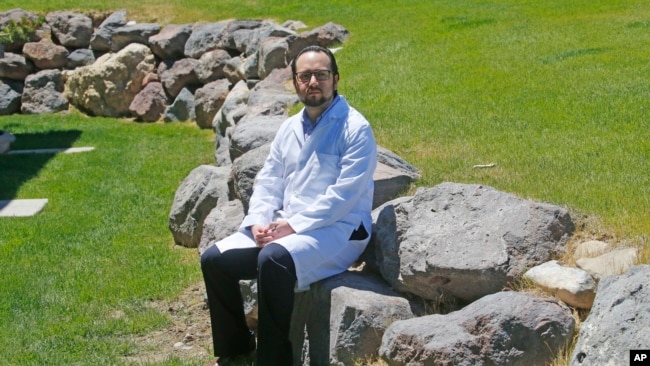 Edison Suasnavas, an immigrant from Ecuador, is a cancer and coronavirus researcher. Here he poses for a photograph near his home in Saratoga Springs, Utah, June 11, 2020.