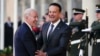 U.S. President Joe Biden greets Ireland's Taoiseach Leo Varadkar as he arrives for banquet held in his honor at Dublin Castle in Dublin, Ireland, April 13, 2023. 