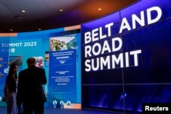 FILE - Visitors attend the Belt and Road summit in Hong Kong, China, Sept. 14, 2023.
