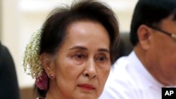 FILE - Myanmar's leader Aung San Suu Kyi, left, attends the bilateral meeting with Chinese President Xi Jinping at the president house in Naypyitaw Myanmar, on Jan. 18, 2020.