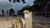 A general view of flowers and a message left at the Le Paquier park, after several children and adults were injured in a knife attack, near the lake in Annecy, in the French Alps, France, June 8, 2023.