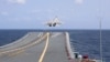 FILE - In this photo released by Xinhua News Agency, a J-15 Chinese fighter jet takes off from the Shandong aircraft carrier during military exercises around Taiwan by the Eastern Theater Command of the Chinese People's Liberation Army on April 9, 2023.