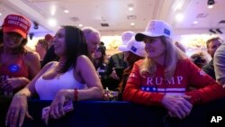 Supporters arrive before Republican presidential candidate former President Donald Trump speaks at a caucus night rally in Las Vegas, Feb. 8, 2024.