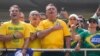 Former Brazilian President Jair Bolsonaro, center, acknowledges supporters during a rally in Sao Paulo, Brazil, Feb. 25, 2024. Bolsonaro and some of his former top aides are under investigation over allegedly plotting a coup to remove his successor, Luis Inacio Lula da Silva.