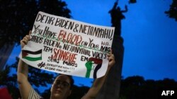 People hold a demonstration in support of Palestinian people, organized by the Committee of solidarity with the Palestinian people in front of the US Embassy in Rio de Janeiro, Oct. 31, 2023.