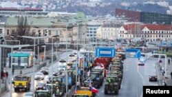 Farmers drive tractors during a protest against European Union agricultural policies, grievances shared by farmers across Europe, in Prague, Czech Republic, Feb. 19, 2024.