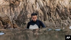 Chinese Huang Wanxiong, a free diving instructor, practices his skills in the sea around Bohol Island in the Philippines on April 16, 2023.