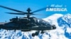 An AH-64E Apache helicopter in flight near Mount Rainier, Washington, July 11, 2022. 