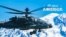 An AH-64E Apache helicopter in flight near Mount Rainier, Washington, July 11, 2022. 
