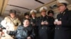 김정은(왼쪽 앉은 이) 북한 국무위원장이 14일 신형 지상 대 해상 미사일 '바다수리-6'형 검수 사격시험을 지도하고 있다며 조선중앙통신이 공개한 사진.