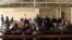 FILE - Members of the Congolese army, sentenced to death for desertion and cowardice when fighting M23 rebels, sit inside a military courtroom during their trial in Goma, North Kivu province, Democratic Republic of Congo, May 3, 2024.