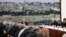 This handout picture provided by the Palestinian Authority's press office (PPO) shows President Mahmud Abbas, center, chairing a meeting for the Palestinian leadership in Ramallah city in the Israel-occupied West Bank, Feb. 18, 2024. 