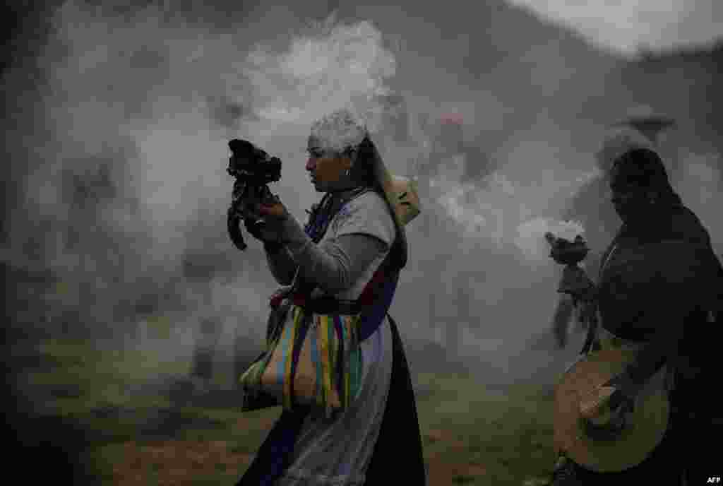 Purepecha's Indigenous people carry incense as they walk during a 3-day ceremonial procession from Cocucho to Ocumicho indigenous villages in Michoacan State, Mexico, Jan. 31, 2024. 