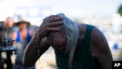 A person cools off during the Waterfront Blues Festival in Portland, Oregon, July 5, 2024.