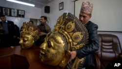 FILE - Masks of Hindu deity Lord Bhairabh dated from 16th century that were stolen from Nepal's Dolakha district are displayed during a press conference at the Department of Archaeology in Kathmandu, Nepal, Jan. 31, 2024.
