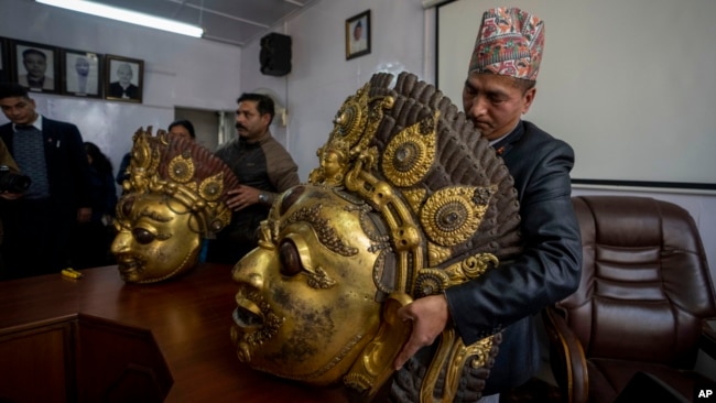 FILE - Masks of Hindu deity Lord Bhairabh dated from 16th century that were stolen from Nepal's Dolakha district are displayed during a press conference at the Department of Archaeology in Kathmandu, Nepal, Jan. 31, 2024.
