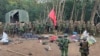 FILE - Members of the Myanmar National Democratic Alliance Army pose for a photograph with the weapons allegedly seized from the Myanmar's army outpost on a hill in Chinshwehaw town, Myanmar, Oct. 28, 2023.