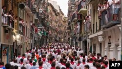 Participants prepare to run during the &quot;encierro&quot; (bull-run) of the San Fermin festival in Pamplona, northern Spain.