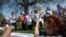 FILE - Immigrants from Nepal dance during a "Rally for Citizenship" on Capitol Hill in Washington, April 10, 2013. Granted special protections under President Barack Obama, they have been ordered by the administration of President Donald Trump to leave the U.S. by June 24, 2019.
