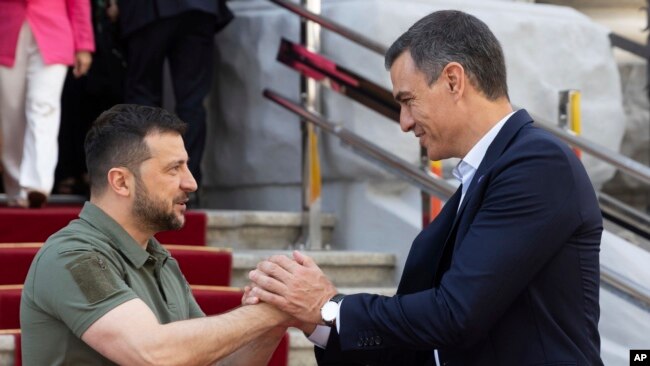 Photo from Ukrainian Presidential Press Office. Ukrainian President Volodymyr Zelenskyy, left, and Spain's Prime Minister Pedro Sanchez shake hands in Kyiv, Ukraine, July 1, 2023.
