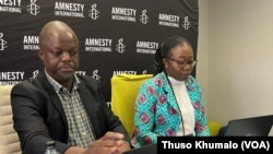 FILE - Amnesty International's Tigere Chagutah, interim regional director for East and southern Africa (L), and Vongai Chikwanda, interim deputy regional director of campaigns for southern Africa, pictured at a press conference in Johannesburg, South Africa, March 27, 2023.