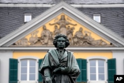 A statue of world famous composer Ludwig van Beethoven is stands in the city center of his birthplace Bonn, Germany, on Tuesday, March 21, 2023. (AP Photo/Martin Meissner)