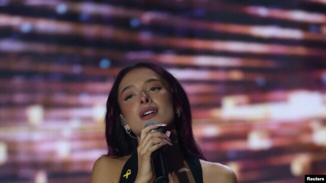 FILE - Eden Golan, Israel's representative for the 2024 Eurovision Song Contest in Malmo sings during the final stage of 'Rising Star', the Israeli Eurovision national selection show, in Neve Ilan, Feb. 6, 2024.