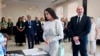 Azerbaijani President Ilham Aliyev, right, and his wife and Vice President Mehriban Aliyeva line up to collect their ballots at a polling station in Baku, Sept. 1, 2024. (Azerbaijani Presidential Press Office via AP)