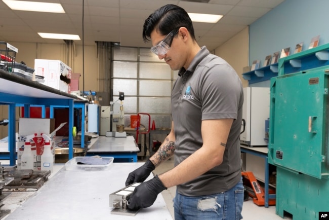 Jesus Gonzalez Pequeno works in the product lab at Fortera's facility in San Jose, Calif., Wednesday, April 10, 2024. (AP Photo/Benjamin Fanjoy)