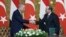 Turkey's President Recep Tayyip Erdogan, left, and Egyptian President Abdel Fattah el-Sissi shake hands during their meeting at Ittihadiya palace in Cairo, Egypt, Feb. 14, 2024. (Turkish Presidency handout via AP)