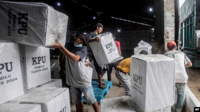 Workers load ballot boxes onto a truck to be distributed to polling stations ahead of Feb. 14 elections, in Medan, North Sumatra, Indonesia, Feb. 12, 2024.
