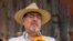 Seed Movement presidential candidate Bernardo Arevalo holds a sunflower during a campaign rally in Santa Maria de Jesus, Guatemala, July 16, 2023. 