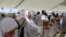 Muslim pilgrims perform the symbolic stoning of the devil ritual as part of the hajj pilgrimage, in Mina, near Saudi Arabia's holy city of Mecca on June 28, 2023.