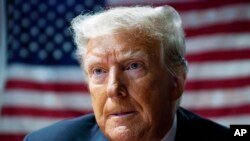 FILE - Former US President Donald Trump speaks with supporters at the Westside Conservative Breakfast, June 1, 2023, in Des Moines, Iowa. 