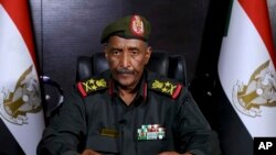 In this image made from video provided April 21, 2023, by the Sudan Armed Forces, Gen. Abdel-Fattah Burhan, commander of the Sudanese Armed Forces, speaks at an undisclosed location in his first speech since fighting in Sudan began nearly a week ago.