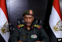 FILE - In this image made from video provided April 21, 2023, by the Sudan Armed Forces, Gen. Abdel-Fattah Burhan, commander of the Sudanese Armed Forces, speaks at an undisclosed location in his first speech since fighting in Sudan began nearly a week ago.