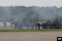 Militer Taiwan mengadakan latihan simulasi pertempuran darat dan udara terpadu di Kabupaten Hsinchu, Taiwan utara, Kamis, 21 September 2023. (AP/Chiang Ying-ying)