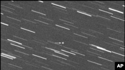 This image provided by Virtual Telescope Project out of Italy shows a single 180-second exposure asteroid that was approaching Earth, about 4 million kilometers away, Jan. 31, 2024. 