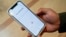 Kai Koerber shows his app, Joy, on July 27, 2023, in Berkeley, Calif. Koerber was a student at Marjory Stoneman Douglas High School when a gunman killed 17 people there in 2018, and has designed an app to help with mental health. 