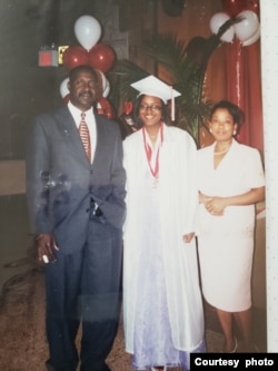 Vania Andre pictured center at her 8th Grade graduation in New York's Cambria Heights. (Family Handout)