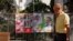 FILE - FILE PHOTO: A man walks past electoral posters ahead of the July 23 snap election, in Ronda, Spain, July 7, 2023. 
