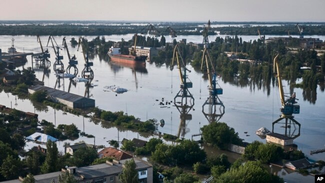 Streets are flooded in Kherson, Ukraine, Wednesday, June 7, 2023 after the walls of the Kakhovka dam collapsed.